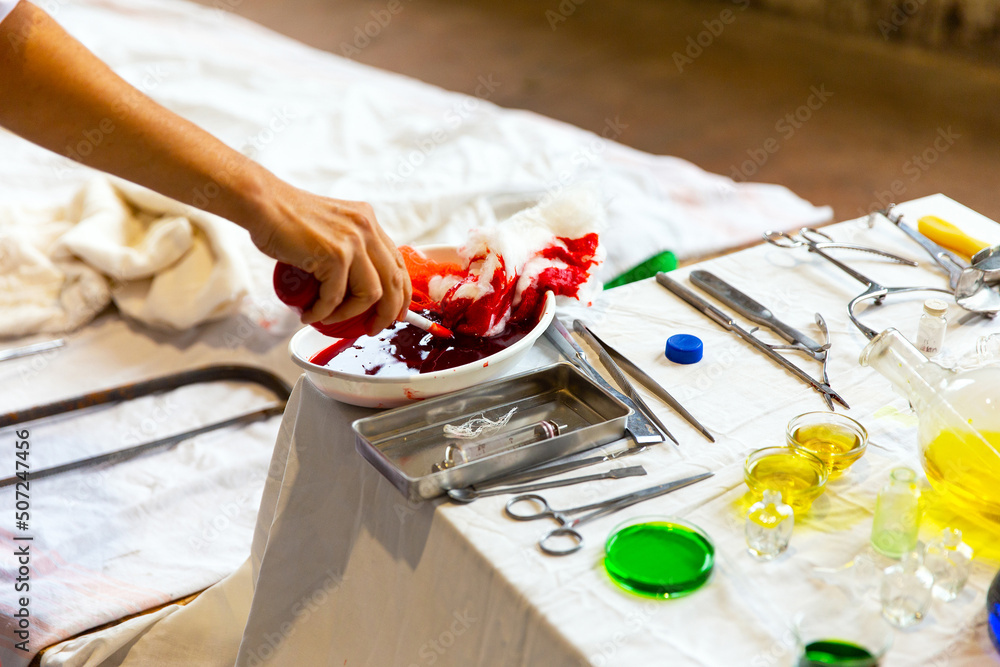 Fototapeta premium Blood, medical cotton, syringe, medicines on the table. After amputation in the clinic
