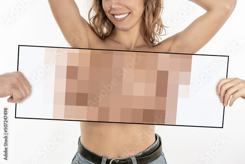 Naked woman's body with blur, censored breast in a cardboard hiding the model's boobs. Isolated in white background photo