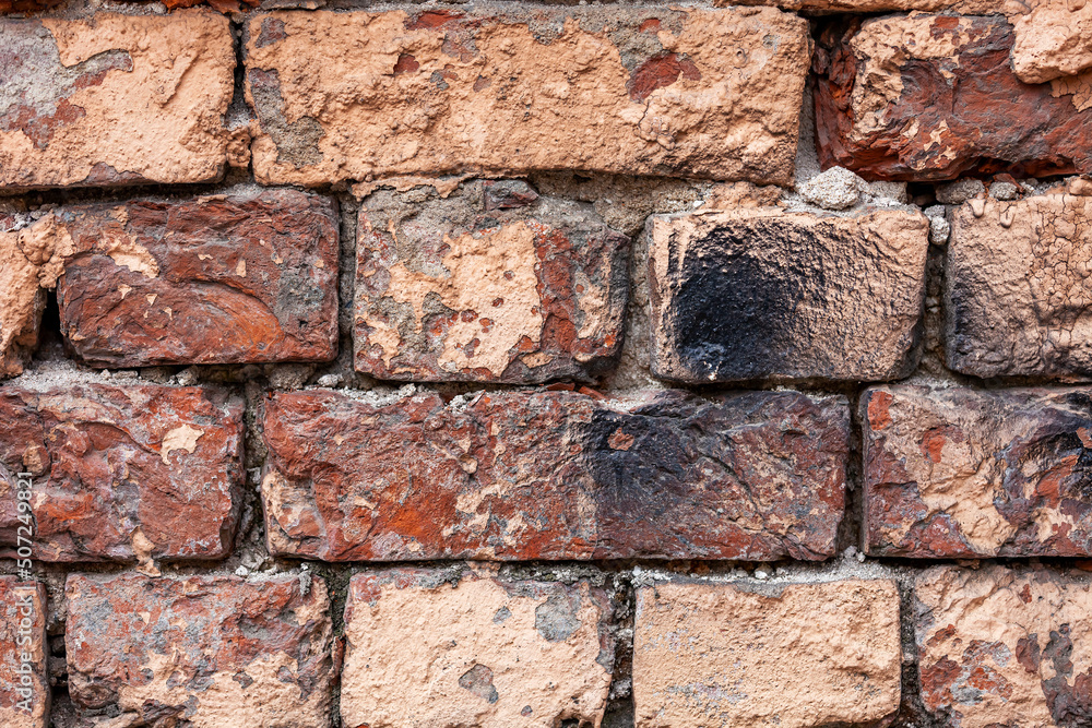 Old wall of chipped bricks Old wall of chipped bricks