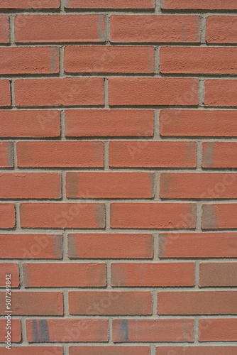 Pattern of modern bricks of a building wall, as a background, closeup, details.
