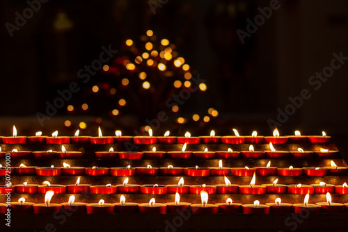Print op canvas Candles are lit by believers at the moment of prayer for peace in the church