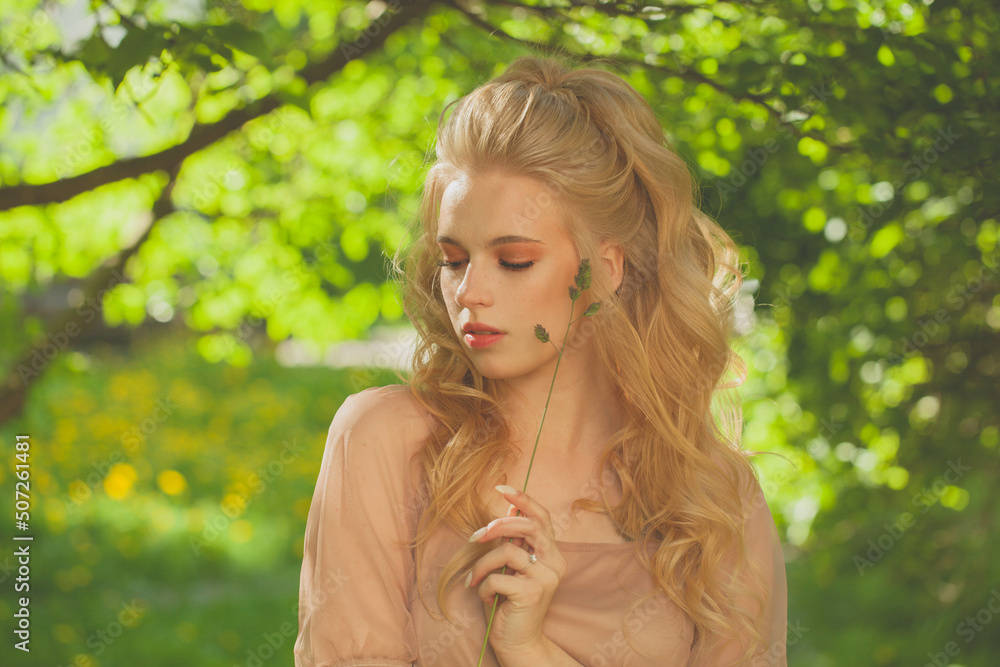 Beautiful woman walking in summer park Beautiful woman walking in summer park