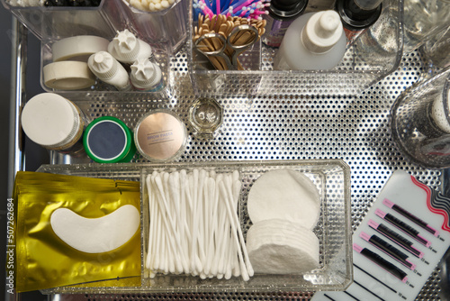 Fotografija consumables for eyelash extension on a metal surface