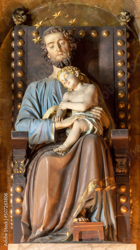 FORLÍ, ITALY - NOVEMBER 11, 2021: The carved statue of St. Joseph on the throne in the Cattedrala di Santa Croce by Emilio Righetti from end of 19. cent. photo
