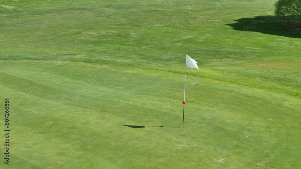 Golf course and the white flag Golf course and the white flag