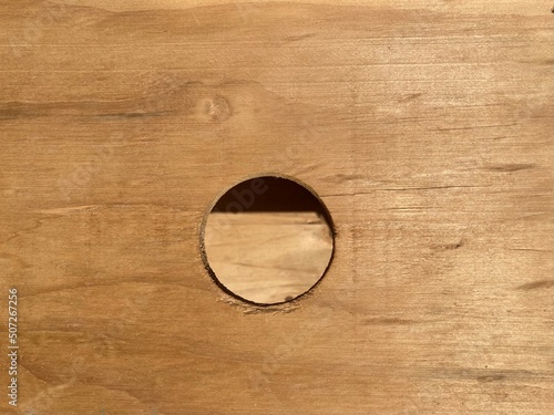 a round hole in a plywood panel