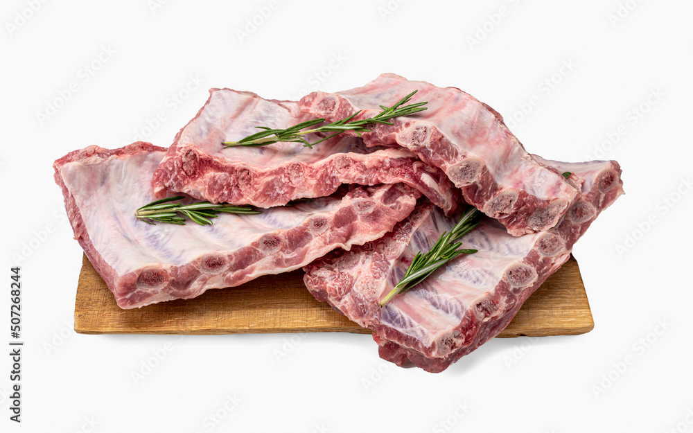 Raw pork ribs. Whole raw pork ribs on wooden board isolated background. Raw meat, farm and cooking concept. Meat shop.