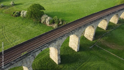 View over Arthington viaduct and fields near Otley in the Yorkshire countryside. Drone aerial view photo