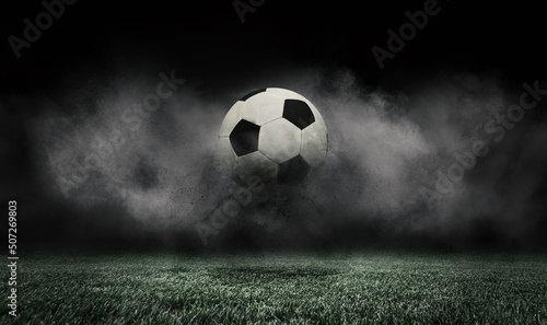 Soccer ball jumping on green grass of football field isolated on dark background with smoke. Concept of sport, art, energy, power. Creative collage. World cup concept