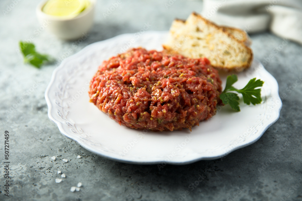 Homemade steak tartare served with bread Homemade steak tartare served with bread
