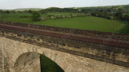 Drone shot above Arthington viaduct train tracks and surrounding green countryside near Harrogate in Yorkshire, UK photo