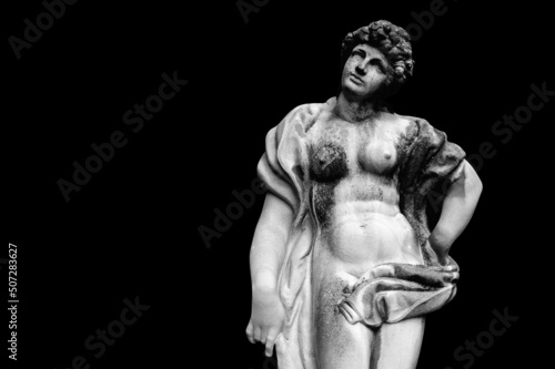 Antique Olympic goddess of love and beauty Aphrodite (Venus) Fragment of ancient statue isolated on black background. Copy space for design. © zwiebackesser
