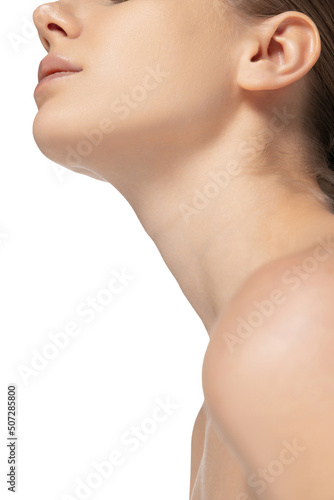 Cropped image of beautiful female face and neck isolated over white studio background. Skincare cosmetology treatment