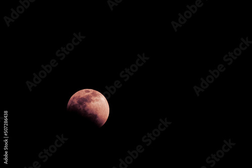 Lunar eclipse night may 2022, partially clear sky, blood moon seen from latin america, Guatemala central america.