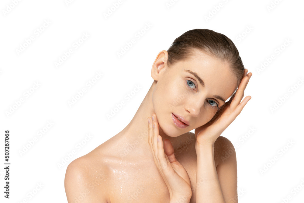Portrait of young tender woman with clean smooth skin, nude makeup posing isolated over white studio background. Cosmetology concept Portrait of young tender woman with clean smooth skin, nude makeup posing isolated over white studio background. Cosmetology concept