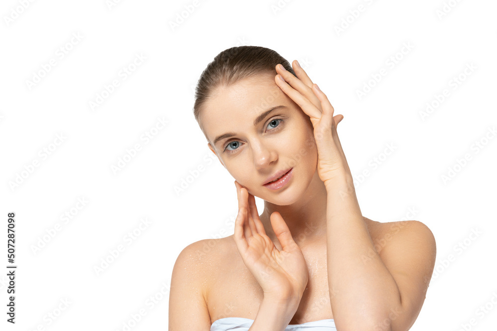 Portrait of young tender woman with clean smooth skin, nude makeup posing isolated over white studio background Portrait of young tender woman with clean smooth skin, nude makeup posing isolated over white studio background