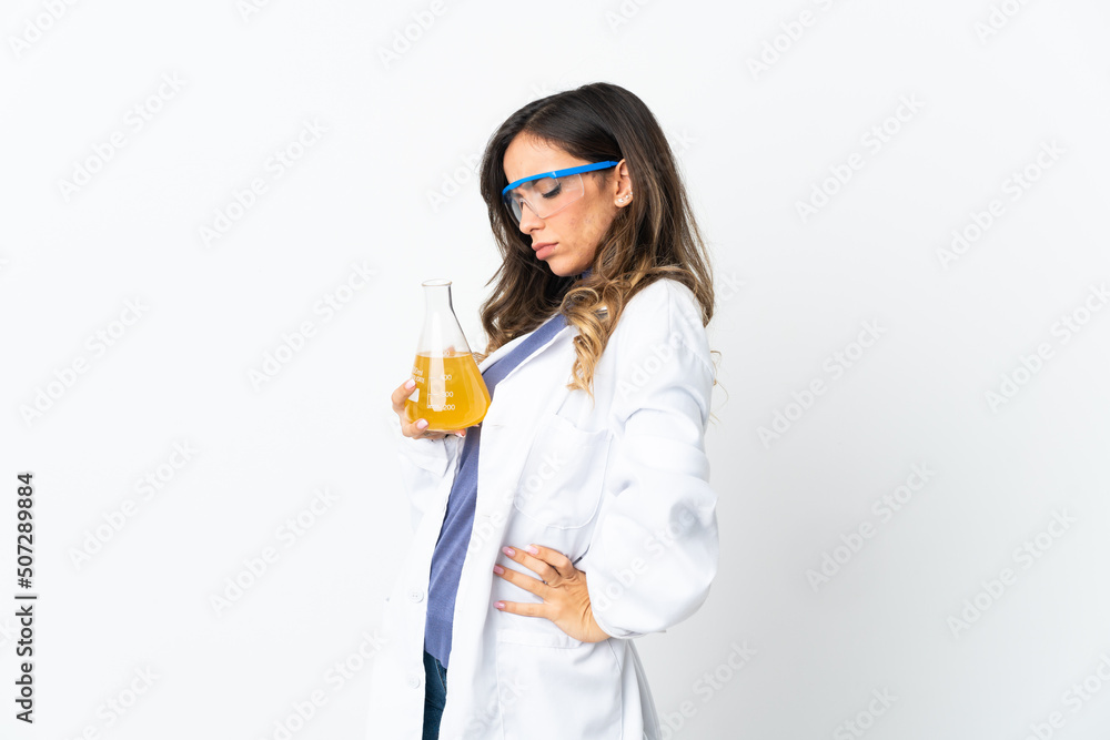 Young scientific woman isolated on white background suffering from backache for having made an effort