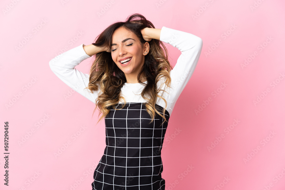 Young caucasian woman isolated on pink background laughing Young caucasian woman isolated on pink background laughing