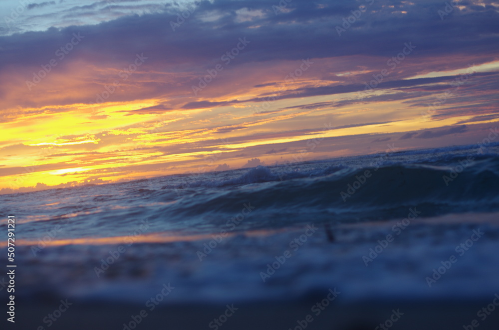 Obraz premium Sunset over the Indonesian coastline