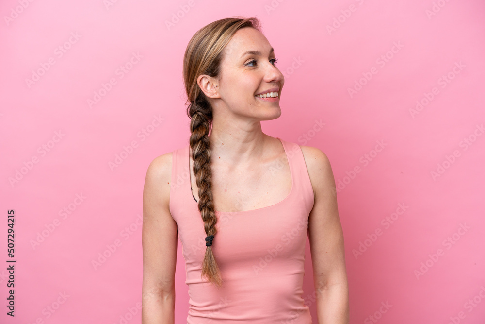 Young caucasian woman isolated on pink background thinking an idea while looking up Young caucasian woman isolated on pink background thinking an idea while looking up