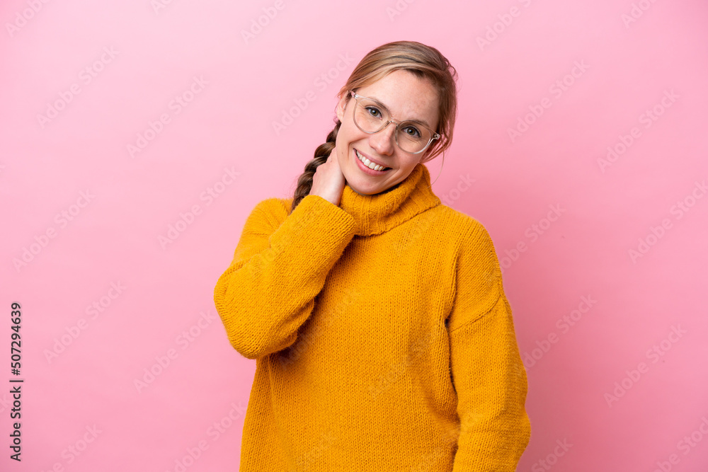 Fototapeta premium Young caucasian woman isolated on pink background laughing