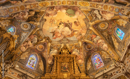 VALENCIA, SPAIN - FEBRUAR 17, 2022: The baroque ceiling of presbytery of church Iglesia San Nicolas with the frescoes by Antonio Palomino and Dionis Vidal (1700). photo