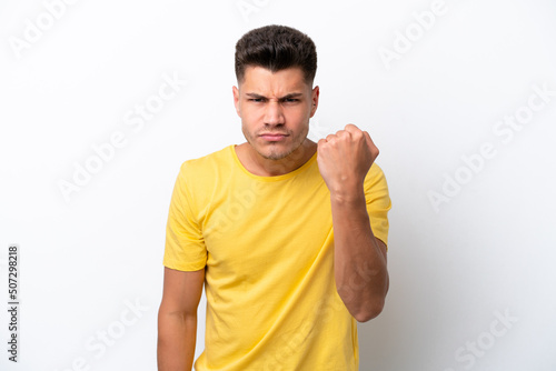 Young caucasian man isolated on white background with unhappy expression