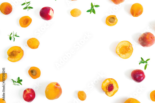 Summer fruits - ripe apricot and peaches with mint leaves on white background. Flat lay.