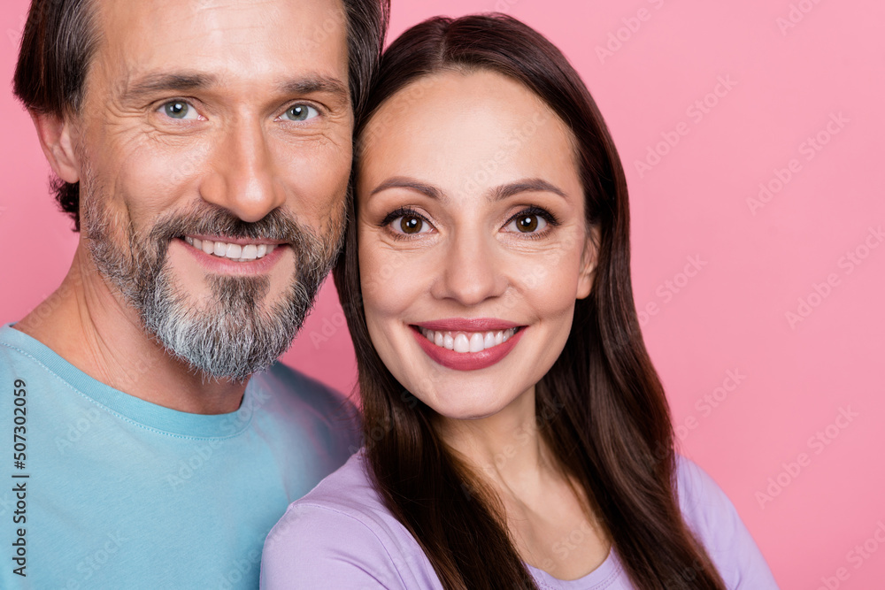 Cropped close up photo of peaceful lovely people toothy smile look camera isolated on pink color background Cropped close up photo of peaceful lovely people toothy smile look camera isolated on pink color background