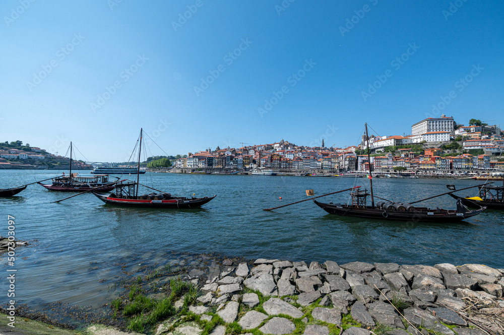 Old wine boats on the coast of the Rio Douro in Porto, Portugal.