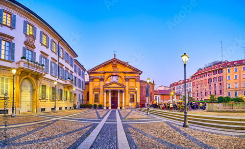 Panorama of the Piazza Borromeo with popular outdoor restaurant neighbors with old Church of Santa Maria Podone, Milan, Italy photo