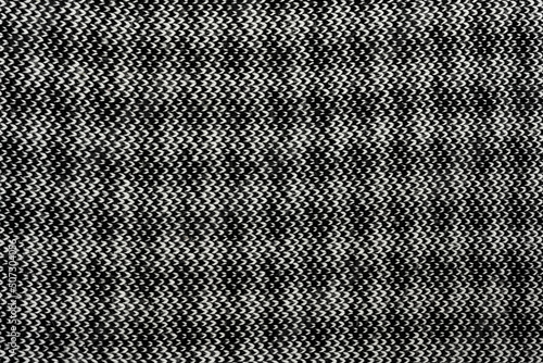 White Black natural texture of knitted wool textile material background. White-black crochet cotton fabric woven canvas texture. close up