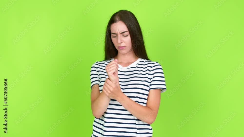 Young brunette woman with pain in hand over isolated background. Green screen chroma key Young brunette woman with pain in hand over isolated background. Green screen chroma key