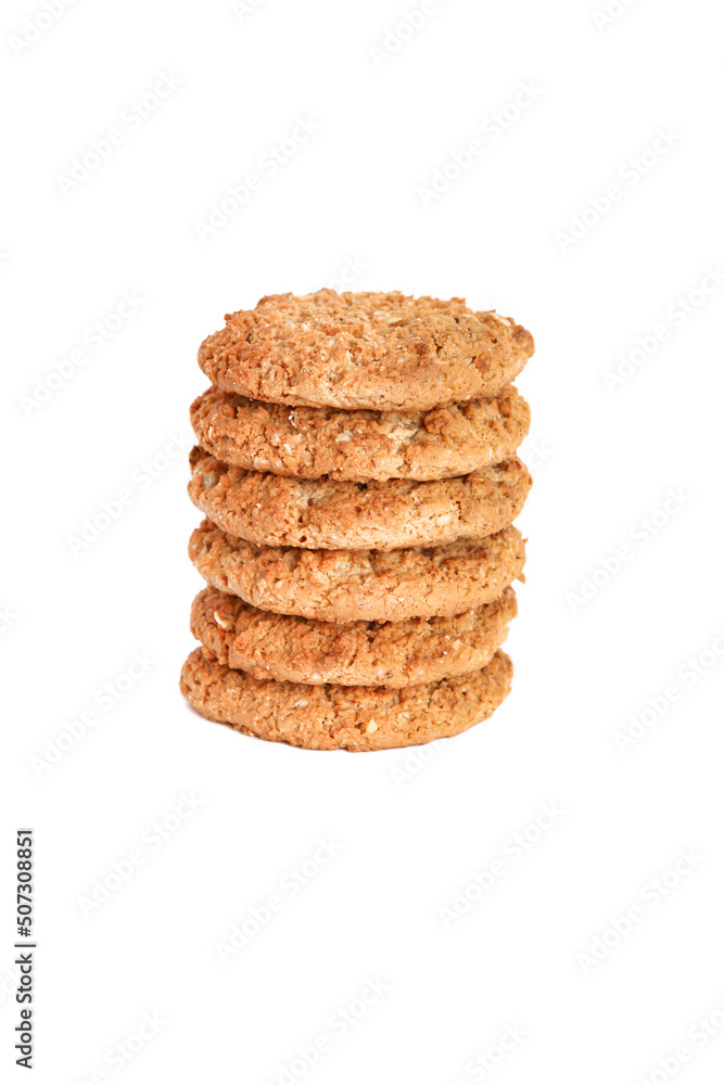 Oatmeal, fig, hazelnut, pistachio and sesame cookies on a white background. Enjoyable snack. Oatmeal, fig, hazelnut, pistachio and sesame cookies on a white background. Enjoyable snack.