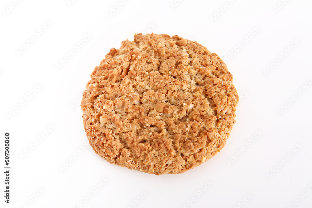 Oatmeal, fig, hazelnut, pistachio and sesame cookies on a white background. Enjoyable snack. Oatmeal, fig, hazelnut, pistachio and sesame cookies on a white background. Enjoyable snack.