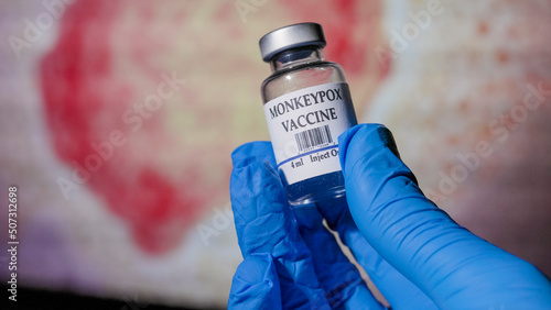 doctor holding a vial of monkeypox vaccine photo