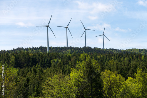 Fototapeta Naklejka Na Ścianę i Meble -  Wind turbines over a forest