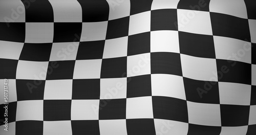 Image of checkered black and white finish line flag waving