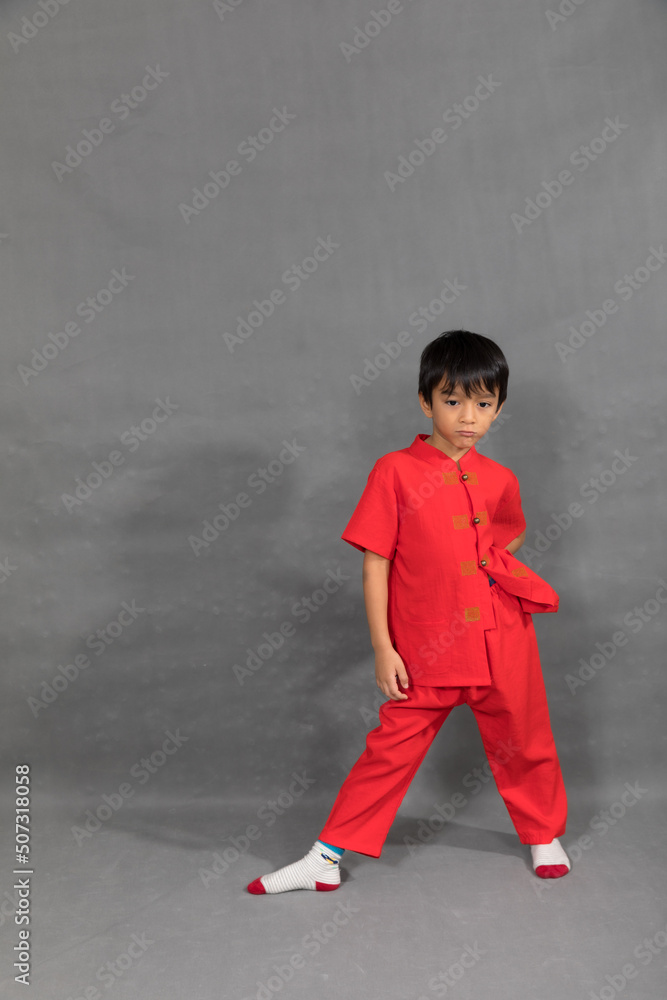 little boy fashion Smiling child in red chinese dress, style and fashion ideas for children.