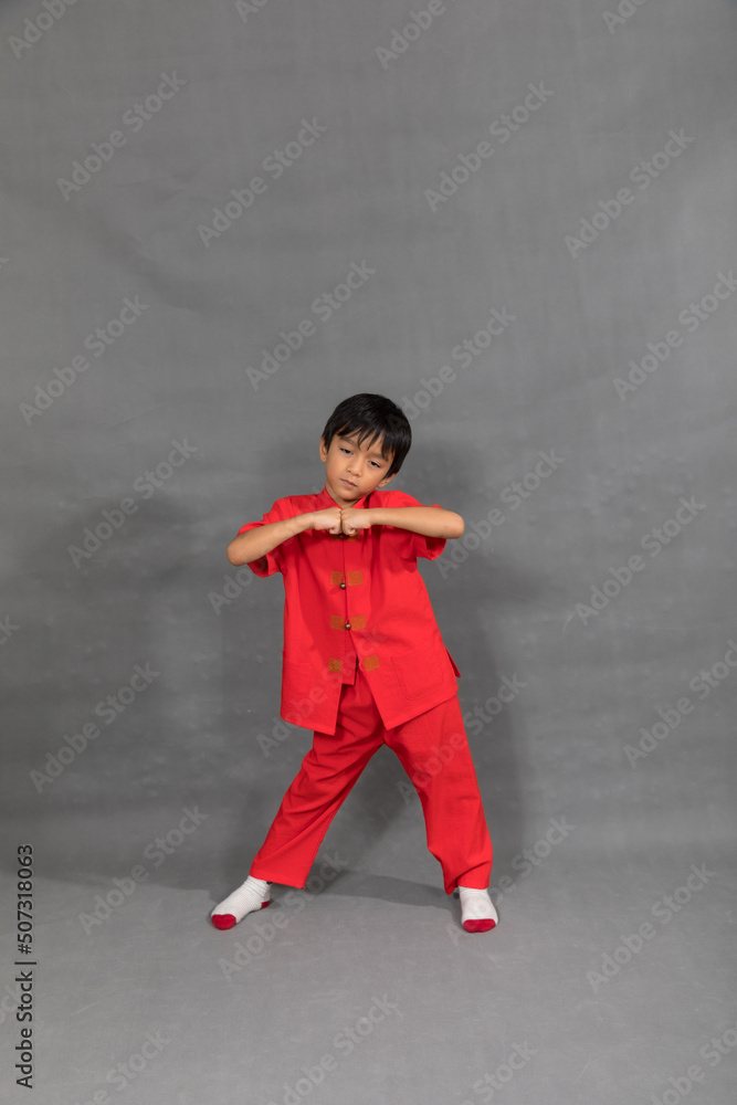 little boy fashion Smiling child in red chinese dress, style and fashion ideas for children.