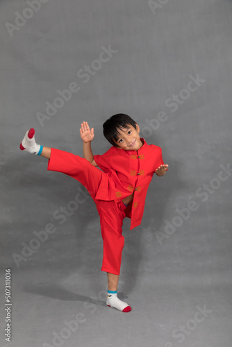 little boy fashion Smiling child in red chinese dress, style and fashion ideas for children.