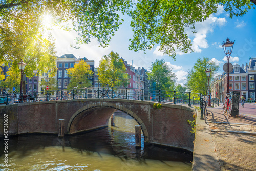 Photography Famous romantic Amsterdam - beautiful sunny day on the old street of Amsterdam