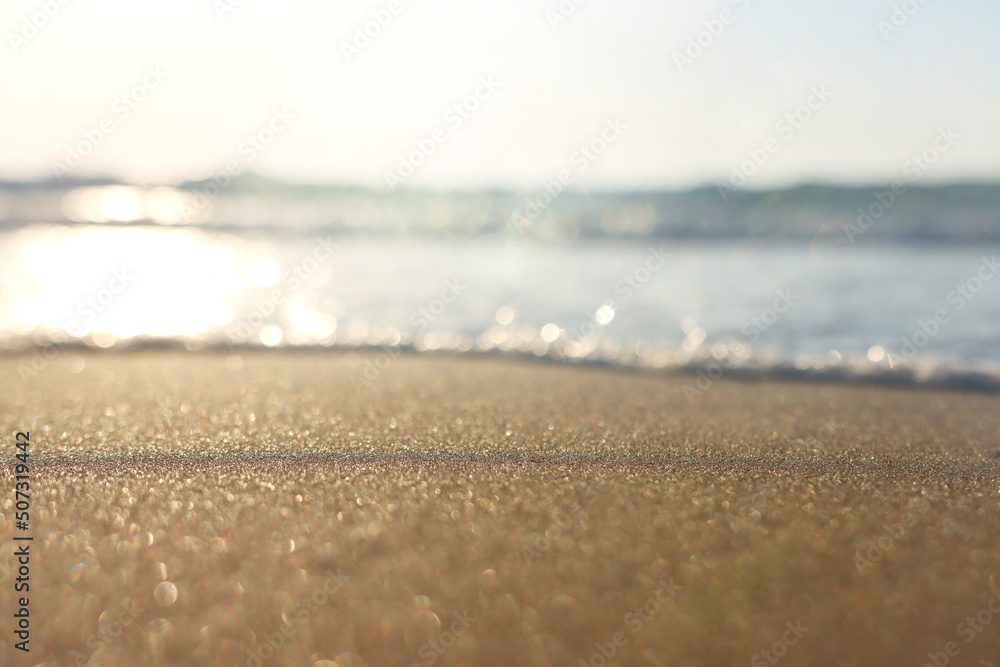 Sea waves and warm sunset light, calm and relaxing sandy beach Sea waves and warm sunset light, calm and relaxing sandy beach