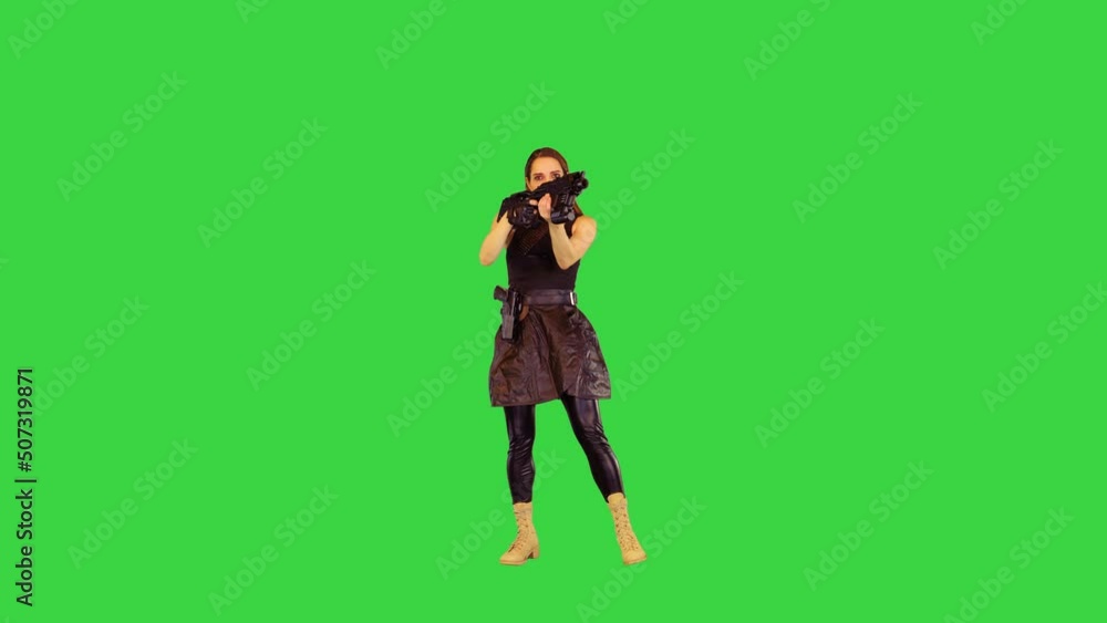 Anime girl poses with machine gun, taking an aim, then goes away on a Green Screen, Chroma Key. Anime girl poses with machine gun, taking an aim, then goes away on a Green Screen, Chroma Key.