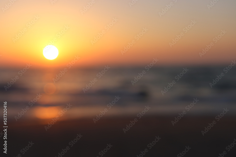 background of blurred beach and sea with bokeh lights