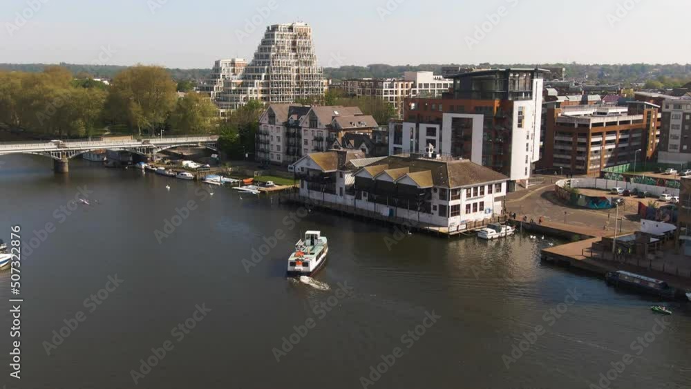 Beautiful architecture of Kingston near river Thames while boat is docking, aerial view Beautiful architecture of Kingston near river Thames while boat is docking, aerial view