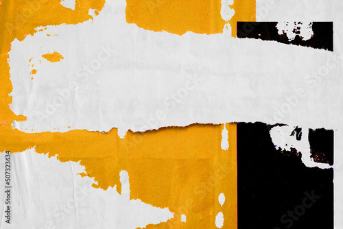 Old ripped torn grunge posters and backgrounds creased crumpled paper backdrop surface placard yellow white black