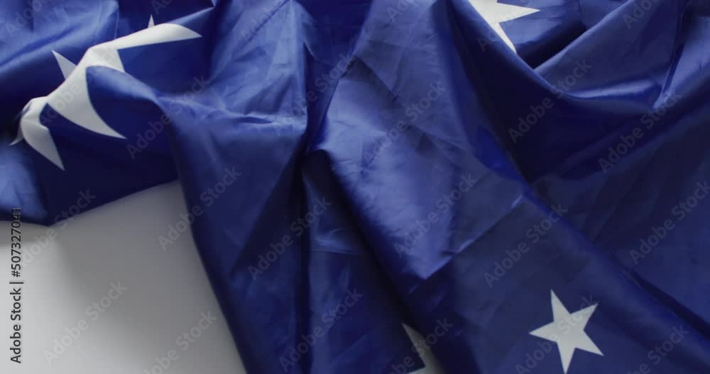Video of creased flag of australia lying on white background Video of creased flag of australia lying on white background