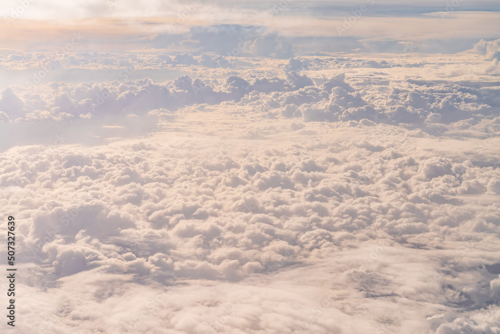 View over the clouds above Tanzania. Bright skyscape