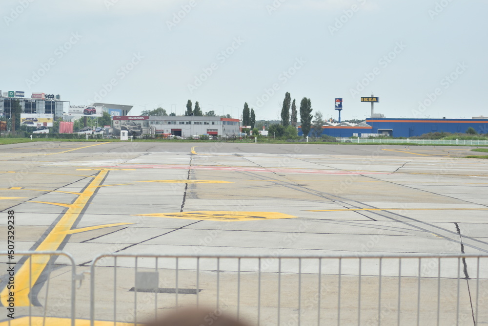 Aircraft parking zone with yellow stripes